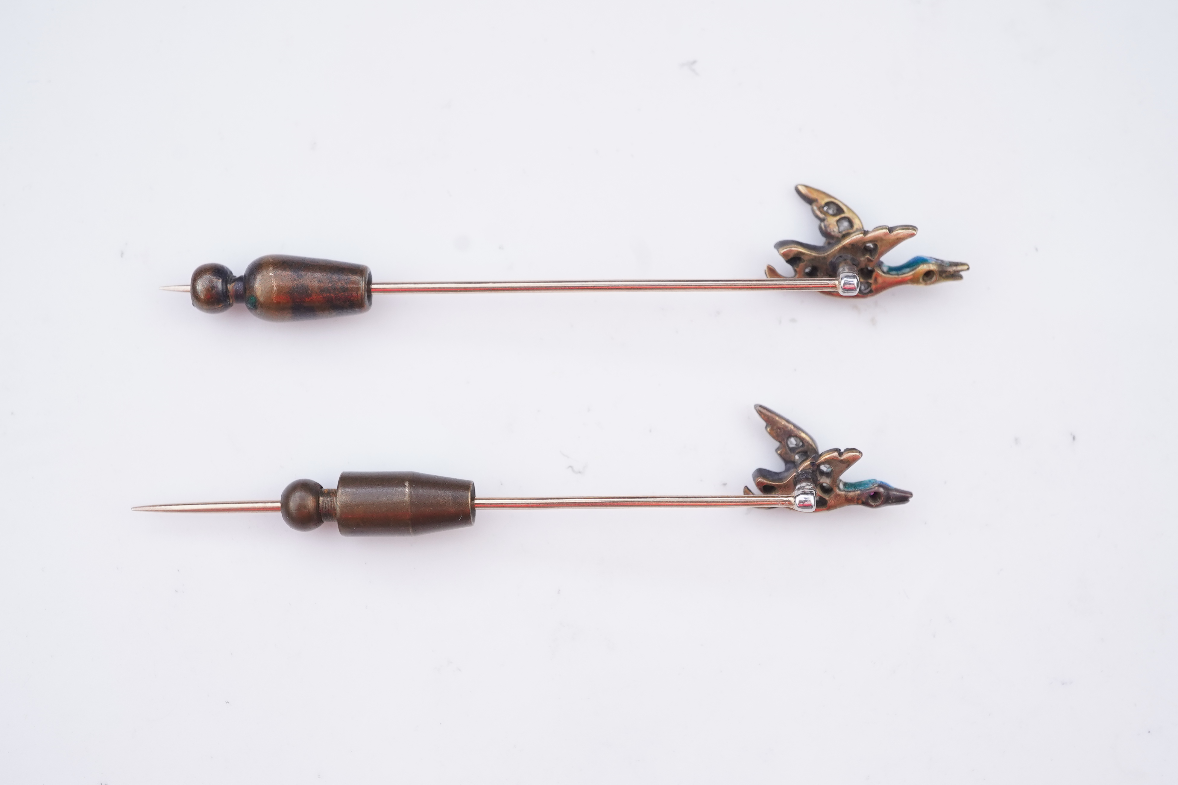 A pair of novelty enamel and diamond stick pins, circa 1900